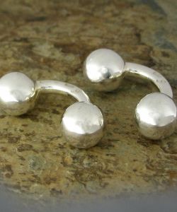 Sub foto Gemelos de bolas de plata.